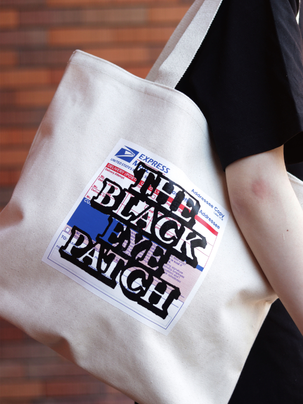 BLACK EYE PATCH PRIORITY LABEL TOTE - BOOMERANG,Lola,Thingsly公式