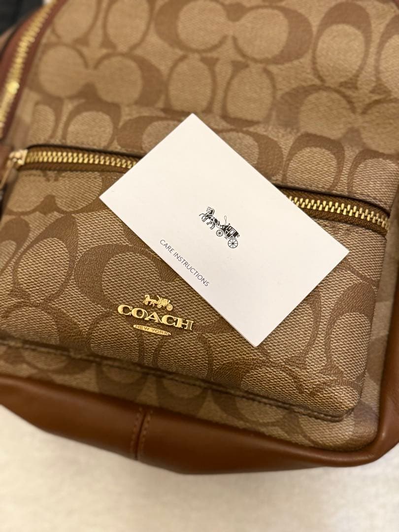 COACH ロゴプリント ブラウンレザーリュックの通販はau PAY マーケット